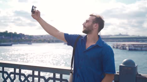 The-young-man-is-taking-a-photo-with-the-phone-in-Istanbul.